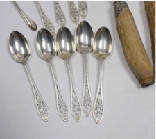 A set of twelve George V silver coffee spoons, with pierced handles, Josiah Williams & Co, London, 1912, 11.5cm, seven other silver spoons, a plated spoon and a three piece stag horn handled carving set.